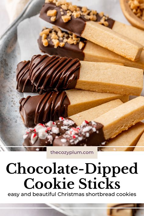 These easy cookie sticks have a tender shortbread base with a snap that’s satisfying to bite into and are dipped in your favorite chocolate and decorated with festive sprinkles, nuts, or candies. If you’re looking for a crisp, buttery cookie for your Christmas cookie box that’s both eye-catching and delicious, these aesthetic Christmas shortbread cookies are just what you need! Tuile Cookies Recipes, Shortbread Cookie Logs, Half Dipped Cookies, Pretzel Shortbread Cookies, Christmas Sprinkles Cookies, Christmas Food Inspiration, Shortbread Dipped In Chocolate, Cookie Sticks Decorated Christmas, Turtle Shortbread Cookies