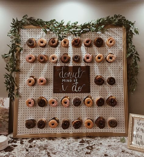 Donut wall | wedding ideas | donuts | cool wedding ideas | donut mind if I do | greenery | dessert | dessert ideas for wedding | party ideas Doughnut Wall Wedding Diy, Dessert Corner Wedding, Donut Walls For Weddings, Donut Pegboard Wedding, Donut Wall Ideas, Donut Mind If I Do Donut Wall, Donut Pegboard Diy, Donut Stand Wedding, How To Make A Donut Board