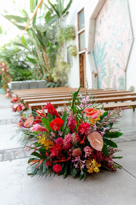 tropical inspired aisle floral arrangement #DTLAwedding #colorfulweddingplanner #tropicalinspiredwedding Tropical Wedding Flowers Ceremony Arch, Island Floral Arrangement, Tropical Wedding Aisle Flowers, Tropical Aisle Flowers, Tropical Ceremony Arch, Tropical Floral Design, Tropical Glam Wedding Decor, Jungle Reception, Tropical Flowers Arrangements