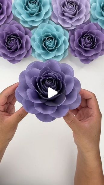 Hey, I’m Judy 👋🏻 Paper Flower Art + Tutorials on Instagram: "In my head, I’ve been calling this rose my “Camellia Rose” and so that’s what I’ve named it. Not an exact Camellia, but the round outer layers look like the round Camellia petals so I’m going for it! Will be posting a tutorial and list the template in my Etsy shop later today 🌸🌺 Isn’t this purple cardstock lovely? I realize I should have made them pink, but I couldn’t resist! #paperflowers #cricut #teamcricut #cricutcreations #make Round Paper Craft, Layered Paper Art Template, Flower Making Crafts, Giant Flowers Diy, Flower Petal Template, Paper Rose Template, Paper Embellishments, Making Fabric Flowers, Paper Flower Art