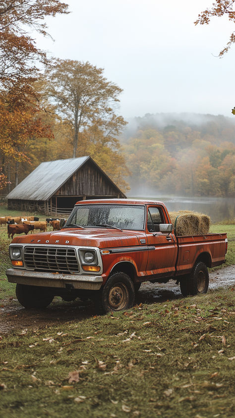 A vintage red Ford pickup truck parked in a field with hay bales in the back. There is a barn and a lake in the background, and the trees are turning red and orange. Vintage Truck Wallpaper Iphone, Old Ford Trucks Vintage Wallpaper, Fall Pickup Truck, Fall Truck Drawing, Vintage Trucks Aesthetic, Old Trucks Aesthetic, Pick Up Trucks 4x4, Fall Truck Wallpaper, Rural Life Aesthetic