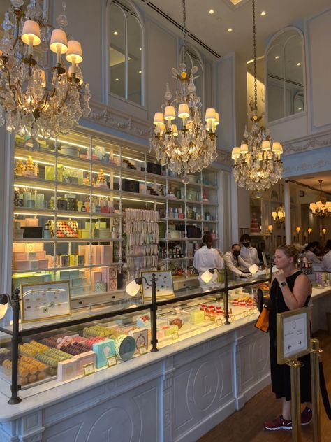 display of desserts and macarons French Patisserie Shop Interior, Cake Display Counter, Macaron Store, Cake Shop Interior, Macaron Bakery, Tea Room Design, Patisserie Shop, Patisserie Design, Bakery Shop Design