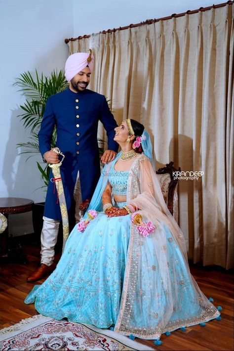 This couple paired their outfit with the bride in a light blue lehenga and the groom in a midnight blue sherwani! #weddinginspo #shaadisaga #groom #bride #bridal #weddinginspiration Light Blue Lehenga Bridal, Blue Sherwani Groom, Aqua Blue Lehenga, Light Blue Lehenga, Blue Bridal Lehenga, Kiran Bedi, Couple Dresses, Contrast Outfit, Indian Fits