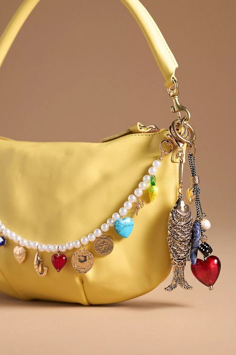 Aesthic Things To Buy, Jelly Cat Bag Charm On Bag, Hello Kitty Bag Charm, Bag Charm Trend, Charm Bag Crochet, Unique Accessories Fashion, Bead Bag Charm, 2024 Jewelry Trends Women, Purse Charms Aesthetic