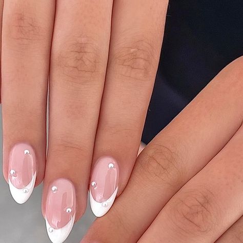 peachi nails on Instagram: "the perfect wedding mani 🤍💍🐚 classic white french tip with 3d pearl embellishments 💅🏼  @cmp_beautysupplies gel polishes used: ��🤍barely there 🤍french white - - - - #nails #nailart #naildesign #nailinspiration #nailsofinstagram #nailinspo #wedding #weddingnails #weddingmanicure #bridal #bride #bridalnails #weddinginspo #engagementring #manicure #salon #beauty #cosmetics #jewellery #jewelry #frenchtipnails" Nails With Pearl Design, Pearl Nails For Wedding, Pearl French Manicure, Pearly French Nails, Wedding Nails For Bride Classy Bridal Pearl, Bridal Pearl Nails, Pearl Nails Wedding, White Nails Pearl, Wedding Nails Pearl Brides