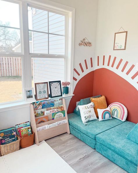 Montessori Inspired Mama on Instagram: “📚Reading Nook ⏩ Swipe ⏩ Front Facing Display And we did a thing with the wall ☀️ 🧡 Do you like it? ☺️ 📚 Ideas for front facing book…” Toddler Reading Nooks, Sun Mural, Bedroom Reading Corner, Kids Nook, Corner Reading Nooks, Reading Corner Kids, Bedroom Reading Nooks, Reading Nook Kids, Learning Corner