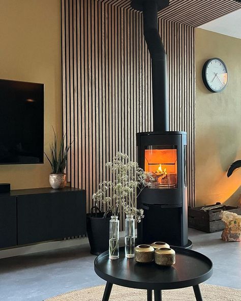 We're feeling inspired by @fem_ke73's Scandi styled living room - a flawless open-plan design that seamlessly ties minimalism with cosyology. We love the combination of the glowing Contura stove combined with the natural texture of the feature wall. 🔥 📸 @fem_ke73 #conturastoves #cosyology #flames #woodburningstove #woodburner #woodburnerstove #fireburning #cosyfire #interioredesign #scandinavianlivingroom Modern Log Burners, Timber Feature Wall, Styled Living Room, Wood Stove Wall, Wood Burning Stoves Living Room, Log Burner Living Room, Modern Stoves, Scandi Living Room, Wood Burning Stoves