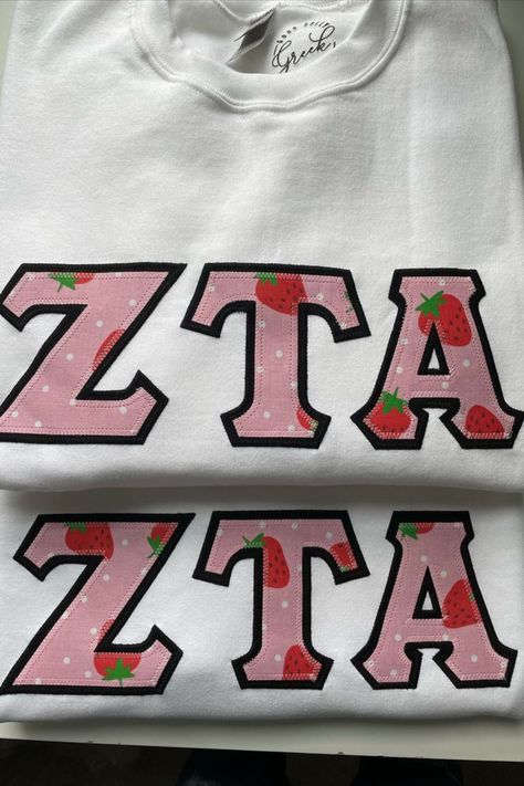 Good Golly Greek Zeta Tau Alpha Strawberry Sorority Stitched Letters. Looking for the perfect gift for the sorority sister in your life? Look no further! These letters are the perfect way to rep a sorority on and off campus. To view all the color combination options, click the link to our website. #SororityApparel#StitchedLetters#ZetaTauAlpha#BigLittleBasket#InitiationBasket Strawberry Sorority, Sorority Stitched Letters, Zeta Tau Alpha Letters, Zta Letters, Sorority Baskets, Sorority Shirts Letters, Big/little Baskets, Greek Letter Shirts, Stitched Letters