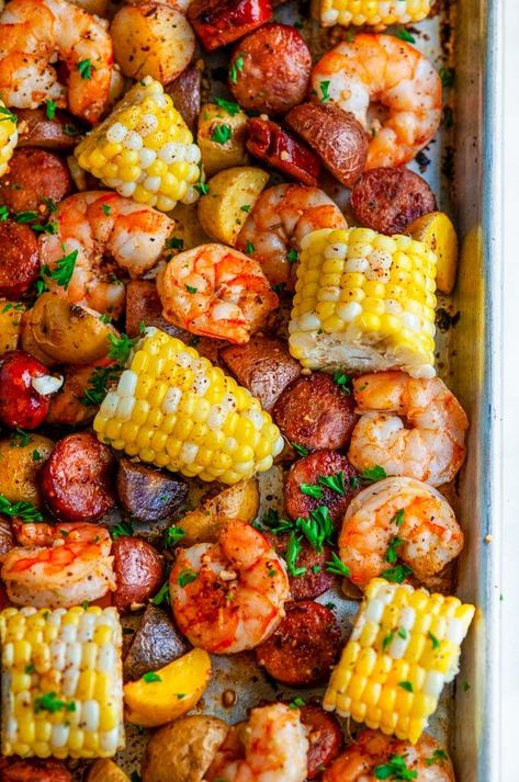 Sheet Pan Shrimp Boil - All the flavors of a classic shrimp boil without the mess! Creole seasoned juicy shrimp, andouille sausage, potatoes and tender corn. From aberdeenskitchen.com #sheet #pan #shrimp #boil #southern #neworleans #creole #cajun #recipe #dinner #onepot Sheet Pan Shrimp Boil, Pan Shrimp Boil, Sheet Pan Shrimp, Pan Shrimp, Seafood Boil Recipes, Sheet Pan Dinners Recipes, Juicy Shrimp, Boiled Food, Berbuka Puasa