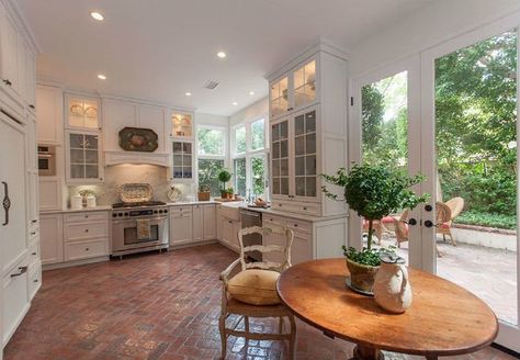 From your foyer to your kitchen, high-traffic interior spaces could benefit from price-wise, easy-care surfaces like brick floors. Here's why. Brick Kitchen Floor, French Door Decor, Brick Floor Kitchen, Brick Floors, Brick Floor, Cottage Style Kitchen, Modern Flooring, Kitchen Floors, Brick Kitchen