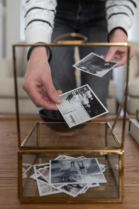 Creative Ways to Display Family Photos in Your Home - Nick + Alicia Antique Photo Wall Display, Storage Picture Frame, Framing Photos Ideas, Displaying Photos In Living Room, What To Do With Pictures Prints, Family Portrait Above Fireplace, Where To Put Family Photos In House, Display Family Heirlooms, Curated Gallery Wall