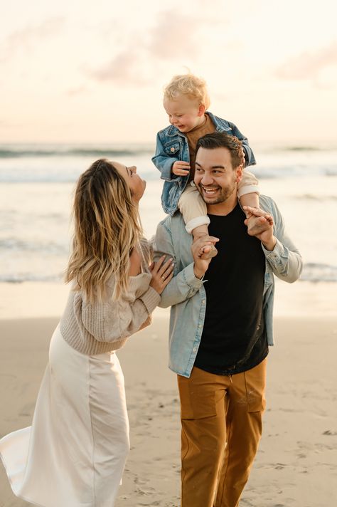 San Diego family photos of young family walking along beach at sunset with dad holding toddler boy on his shoulders at Fletcher Cove Solana Beach California Summer Family Photos Beach, Modern Family Beach Pictures, October Beach Family Pictures, Family On The Beach Photography, Golden Hour Beach Family Photoshoot, Fall Family Pictures Outfits Beach, Formal Beach Photoshoot, Family Beach Pictures Winter, Family Of 3 Beach Photoshoot