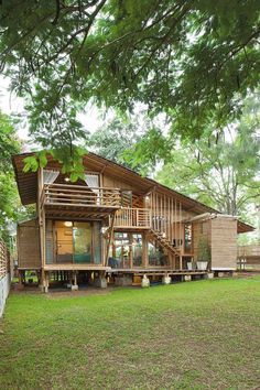 A Bamboo House Embraced by Nature Big Wooden House, Bamboo Building, Modern Tropical House, Tropical Lifestyle, Hut House, Tropical House Design, Bamboo House Design, Jungle House, Bamboo Architecture