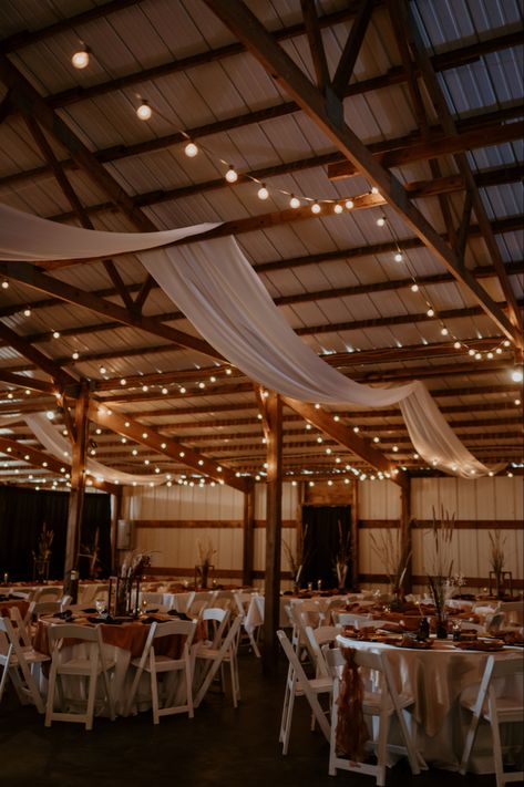 Riding Arena Wedding, Light Pink Western Wedding, Boathouse Wedding Decor, Country Wedding Set Up, Rustic Wedding Venue Decor, Western Indoor Wedding, Boho Prom Decorations, Wedding In Shed, Barn Quinceanera Ideas