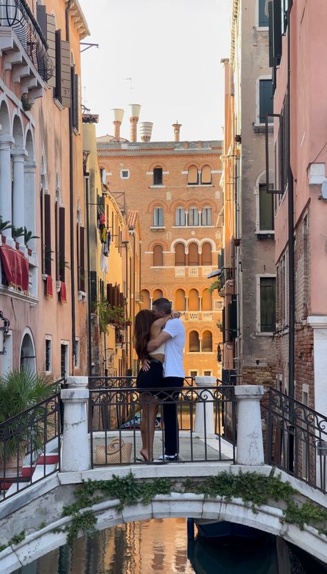 A couple hugging on a bridge in Venice Italy Couple Vacation Pictures Italy, Italian Relationship Aesthetic, Venice Italy Honeymoon, Italy Travel Aesthetic Couple, Italy Travel Couple, Venice Couple Aesthetic, Travel With Partner Aesthetic, Traveling With Partner Aesthetic, Italian Summer Love