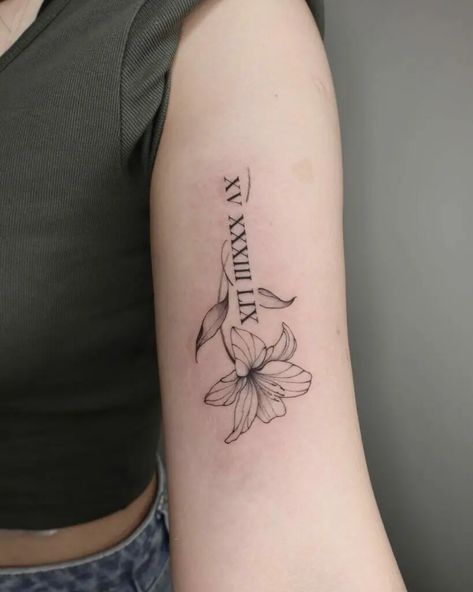 Flower With Name Tattoo Ideas, Roman Numeral Tattoo With Lily, Daffodil Tattoo With Roman Numerals, Floral Name Tattoos For Women, Name And Birth Date Tattoo, Flowers With Roman Numerals Tattoo, Roman Numerals With Flowers Tattoo, Flower Tattoo With Roman Numerals, Flower Date Tattoo