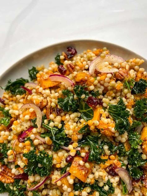 This Autumn pearl couscous salad is a great side dish for this time of year. It is full of fall flavors like squash, cranberries, and pecans. Pearl Couscous Sweet Potato, Veggie Forward Recipes, Healthy Autumn Dinner, Autumn Kale Salad, Truffle Couscous, Autumn Casseroles, Isreali Coucous, Cooking For Husband, Cheap Vegetarian Recipes