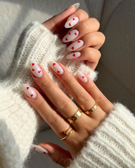 Valentine’s Day nail inspo ❤️💌 * * Nail art, nail design, Vday nail, heart nails, nail with heart design, minimal Valentine’s Day nails, Vday nail inspo, heart nail art, Valentine’s Day nail, heart nails, neutral nails, nail art design, almond nail, trendy nails, nude nails, white nails, Pinterest nail * #nails #nailsofinstagram #heartnails #heartnailsdesign #heartnailart #nailart #nailinspo #naildesign #nailsdesign #nailartist #nailaddict #vdaynails #valentinesnails #vdaynailart #valentines... Heart Print Nails, Nails With Hearts On Them, Nude Nails With Heart Design, Nail With Heart Design, Nail Art Heart Design, Mini Heart Nails, White Nails With Hearts, Simple Heart Nail Designs, Trendy Nails Nude