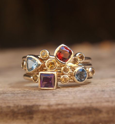 Multistone stacking set in recycled 9ct yellow gold. Multi Colour Gemstone Rings, Harlequin Engagement Ring, Colourful Gemstone Jewellery, Nine Gems Ring, Stacking Gemstone Rings, 3 Gemstone Ring, Multiple Gemstone Rings, Contemporary Ring Design, Multi Stone Rings Unique