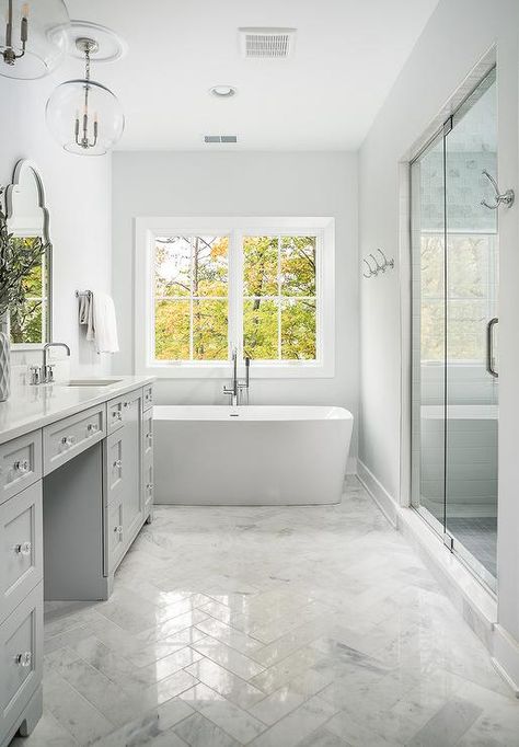 Polished marble herringbone bath floor tiles bringing dimension and sheen to a white and light gray bathroom design. Light Grey Bathrooms, Grey Bathrooms Designs, Marble Bathroom Floor, Best Kitchen Design, Bad Inspiration, Herringbone Floor, Trendy Bathroom, Grey Flooring, Bathroom Floor Tiles