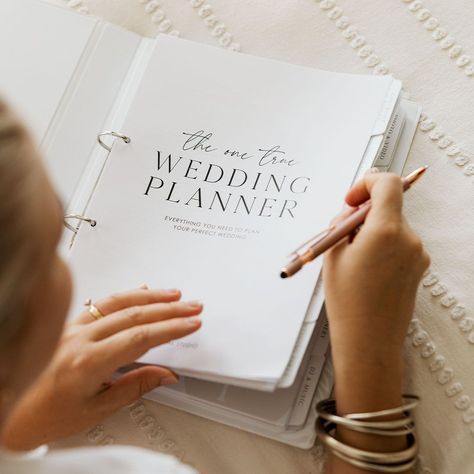 Planning your dream wedding should be a joy, not a scramble. That's why our  stylish A4, two-ring binder file is here to help. Crafted with love by our Perth team, this isn't mass-produced; it's made with the personal touch you deserve.  Featuring 25 tabbed compartments, your wedding plans will be perfectly organized. Select a design you adore for the personalized cover and spine, printed on premium paper and nestled within a sturdy plastic insert. Expect your cherished file within a week (plus shipping time), with standard or express options available at checkout. 
.#WeddingPlanning #BrideToBe #WeddingInspiration #EventPlanning #DreamWedding Becoming A Wedding Planner, Planning Wedding Checklist, Diy Wedding Planner Binder, Wedding Planner Aesthetic, Wedding Binder Organization, Wedding Organisation, Rebecca Serle, 2 Ring Binder, Wedding Planner Notebook