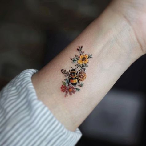 Watercolour Bee Tattoo, Tattoo Of A Bee, Flower Tattoos With Bees, Floral Bee Tattoo Design, Bee Present Tattoo, Wildflower Foot Tattoo, Fluffy Bee Tattoo, Bee And Daisy Tattoo, Bee Tattoo Wrist