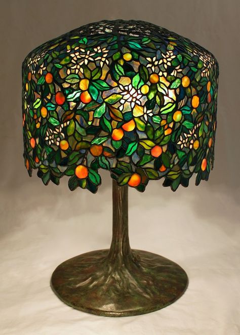 18″ Calamondin Orange Tree lamp. The lamp is an original Century Studios lamp design by Bill Campbell (see the previous post for our design inspiration). The lamp was designed to utilize the Tiffany 18″ Wisteria crown and form, and is now in a private Midwest collection. With just under 2050 individual... Tiffany Stained Glass Lamps, Tiffany Glass Lamp, Tiffany Lamp Aesthetic, Calamondin Orange Tree, Fun Lamps, Interesting Lamps, Bill Campbell, Lamp Inspiration, Studio Lamp