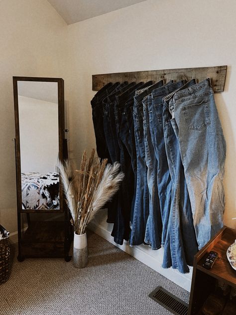 Jeans Hanger Ideas, Western Closet Room, Simple Western Room Ideas Bedrooms, Jean Rack Western, Western Storage Ideas, Bedroom Ideas Western Rustic, Navy Blue Western Bedroom, Boho Closet Room, Western Desk Ideas