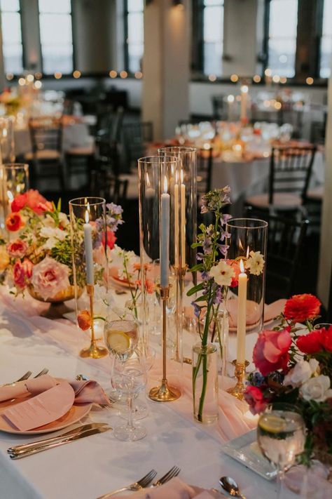 modern wedding colorful florals and candles | Image by Elvira Kalviste Long Table Decor For Wedding, Wedding Table Centerpieces Summer, Summer Wedding Ideas Indoor, August Wedding Decorations, Reception Wedding Decorations Indoor, Indian Tablescape, Wedding Themes Indoor, Wedding Venue Decorations Indoor, Long Table Wedding Decor