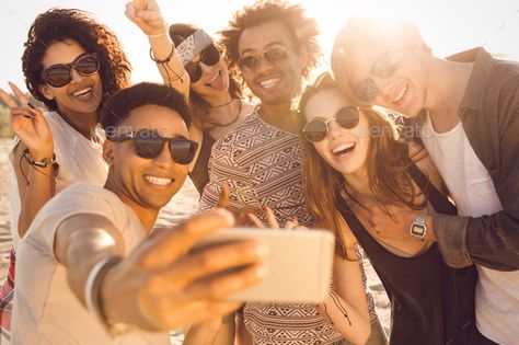 Group of multiracial happy friends taking selfie and having fun by vadymvdrobot. Group of multiracial happy friends taking selfie and having fun on a beach Taking Selfie, Photography Trends, Group Shots, Group Photography, Custom Sunglasses, Friends Group, Happy Friends, Finding Happiness, Friends Party