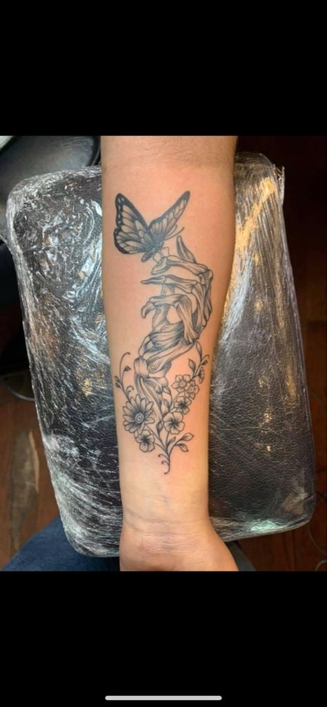 Forearm Tattoo Women Goth, Blended Patchwork Tattoo, Skeleton Hand Holding Butterfly Tattoo, Tattoo Ideas Female Half Sleeve Arm, Starting A Sleeve Tattoo Women, Skeleton Hand With Flower Tattoo, Tattoo Ideas Beauty And The Beast, Inside Of Forearm Tattoo, Tattoo Ideas Lower Arm