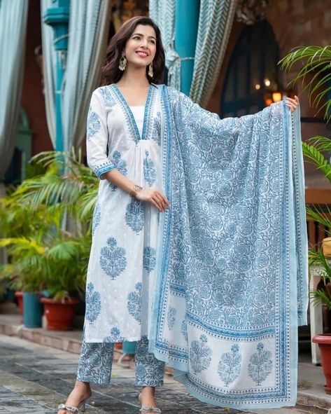 Exquisitely crafted, the Kalina Blue Handwork Suit Set offers a luxurious experience - the perfect pick for any festive occasion. White buta print and embroidery make an eye-catching combination, while a floral jaal print dupatta exudes refined elegance Rendered in the finest cotton, this suit set will have you looking and feeling your absolute best. Fabric - Pure 60/60 Cotton with Cotton Dupatta and with Lining in Kurta Sizes : M/38 , L/40 , XL/42 and XXL/44 PRICE - 950/-+Ship Extra ... Printed Cotton Suit Designs, Cotton Suit Designs, Churidar Neck, Pure Cotton Suits, Long Tunic Dress, Straight Cut Pants, Desi Fashion Casual, Cotton Kurti Designs, Cotton Dupatta