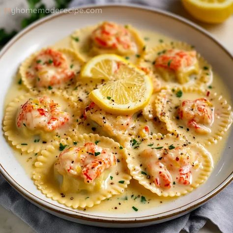 This Lobster Ravioli in Lemon Butter Sauce combines the rich flavors of lobster and a zesty lemon butter sauce for a truly gourmet experience. Lobster Ravioli In Zesty Lemon Sauce, Shrimp Lemon Butter Sauce, Crab Stuffed Ravioli Recipe, Ravioli Lunch Ideas, Lobster Ravioli In A Zesty Lemon Butter Sauce, Lemon Butter Lobster Risotto, Italian Lobster Dishes, Sauce For Shrimp Ravioli, Fancy Cooking Recipes