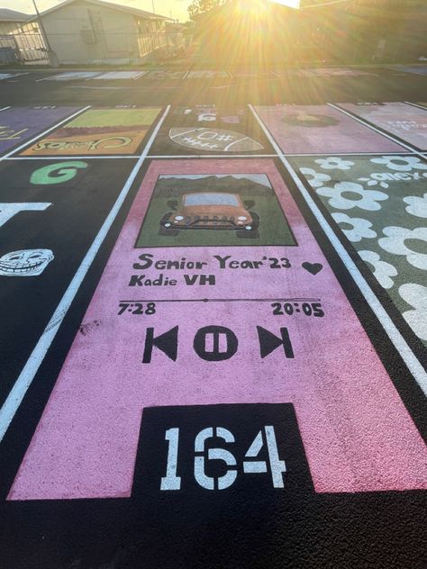 Group Parking Spot Ideas, Senior Paint Parking Spot, Spotify Senior Parking Spot, Parking Spot Inspiration, Senior Parking Lot Ideas, Parking Spot Painting Album Cover, Painted Senior Parking Spot Ideas, Cool Parking Spot Painting, Barbie Parking Spot Painting