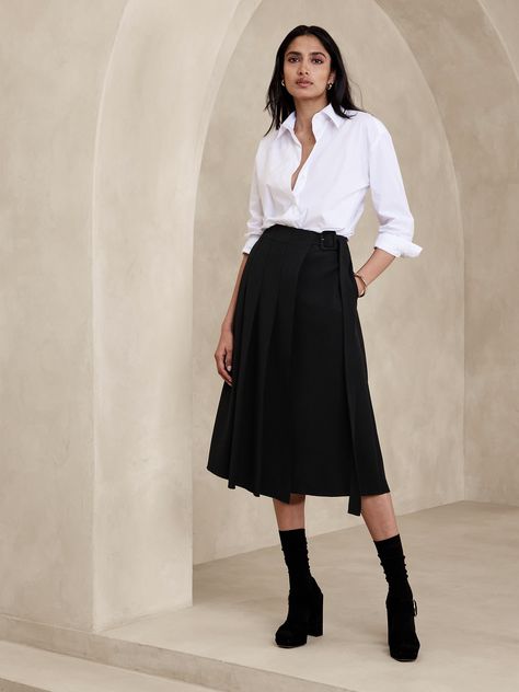 This midi skirt uses a pleated, asymmetrical front to inspire and is cut from a bonded twill fabric we love for its soft structure.  A-line fit.  Adjustable belt at wearer's left.  Side seam pockets.  Raw hem detail.  Unlined.  A-line.  Midi length.  Model: Size 2, 5'10" (178cm). Belted Aline Dress, Work Skirt Outfits Women, Dark Academia Office Wear, Straight Skirt Styles, Button Down Skirt Outfits, Midi Black Skirt Outfit, Gothic Business Casual, Midi Skirt Outfit Work, Corporate Alternative Fashion