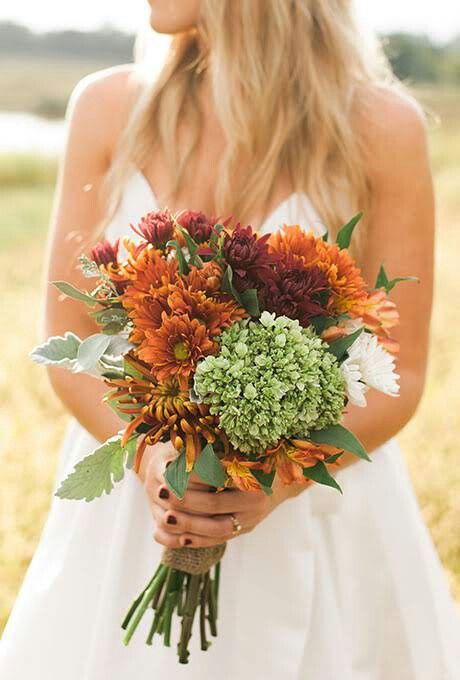 Rustic Autumn Wedding Bouquet Showcasing: Orange Alstroemeria, Yellow-Orange Spider Mums, Yellow/Orange Chrysanthemums, Rust Colored Chrysanthemums, White Chrysanthemums, Green Hydrangea, Dusty Miller + Green Foliage Red Mums, Fall Flower Wedding Bouquets, Chrysanthemum Wedding, Orange Daisies, Fall Wedding Color Schemes, Green Wedding Bouquet, Wedding Flowers Hydrangea, Pumpkin Wedding, Red Bouquet