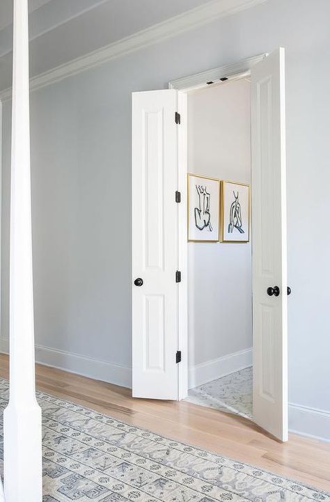 Master bath off bedroom boasts white bi-fold doors, blue walls and a gray vintage rug at entrance. Small Bathroom Door Ideas, Door Ideas For Small Spaces, Small Bathroom Door, Doors For Small Spaces, Narrow French Doors, Small French Doors, Bathroom Door Ideas, Bi Fold Doors, Space Saving Doors