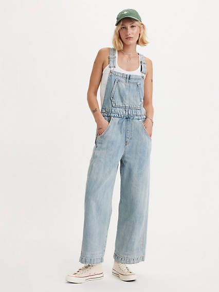 Everyone needs a good pair of overalls, and these Apron Overalls combine a ’90s-inspired loose fit with carpenter-style detailing. And because we're all about utility, we gave it a bunch of pockets and adjustable straps. Vintage-inspired overalls Cut with a loose fit With adjustable straps Features a straight leg and ankle length Crafted from non-stretch denim With a front tie detail We made this garment with post-industrial recycled cotton Women’s Overalls, Patagonia Overalls, 80s Overalls, Levi Overalls, Colored Overalls, Levis Overalls, Cozy Clothes, Cute Overalls, Vintage Overalls