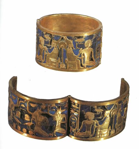 This piece is a bracelette that belonged to Queen Ahhotep, it is gold over a lapis lazuli background and was found in her tomb along with other treasures. This bracelet depicts the god Geb - representing the earth - wearing both crowns of Egypt and giving his blessings to the kneeling king. This piece is found in the Egyptian Museum, Cairo. Ancient Egyptian Jewelry Ancient Treasures, Ancient Egyptian Jewelry Princess, Ancient Egypt Bracelet, Egyptian Jewelry Ancient History, Ancient Egypt Jewelry Tutankhamun, Egypt Jewelry, Egypt Museum, Ancient Egyptian Jewelry, Ancient Jewels