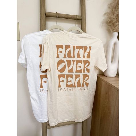 Faith Over Fear Graphic Tee | Screen Print Graphic Tshirt | Christian Apparel | Christian Tshirt | Graphic Christian Tee Faith Over Fear Graphic Tshirt Sizing: Unisex (See Size Guide In Photos For Measurements) Color: Ivory 100% Cotton Brand: Comfort Colors Design Bible T Shirt Design, Christian Tshirt Design Ideas Minimalist, Cute Christian Graphic Tees, Bible Verse Shirt Design, Church T Shirt Ideas Design, Church Merch Ideas, Trending T Shirt Designs, Christian Tshirt Design Ideas, Church T Shirt