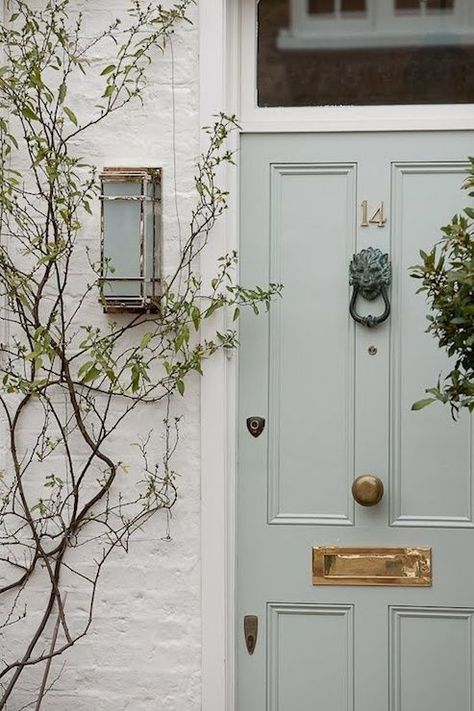 Pale blue door with brass numbers & hardware Blue Gray Shutters White House, White Brick Blue Shutters, Florida White House Exterior, Greenish Gray Exterior House Colors, Sage Green Shutters White House, Sage Door, Painted Brick Exterior, Transitional Home Exterior, Mint Door