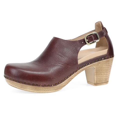 PRICES MAY VARY. CLASSIC STYLE: Our Sassy heeled clog adds unique design to Dansko legendary stapled construction to make these thoughtful heels eye-catching and timeless. ALL-DAY COMFORT: Leather Covered, removable energy-return EVA footbed has Dansko Natural Arch technology for the support and comfort you rely on from every pair of Dansko shoes. LONG-LASTING WEAR: Lightweight PU outsole and high quality burnished leather ensure this shoe will stick with you from season to season. DANSKO WOMEN' Comfortable Work Shoes Women, Comfortable Work Shoes, Work Shoes Women, Wearables Design, Dansko Shoes, Fashion Toys, Work Shoes, Mule Clogs, Leather Cover