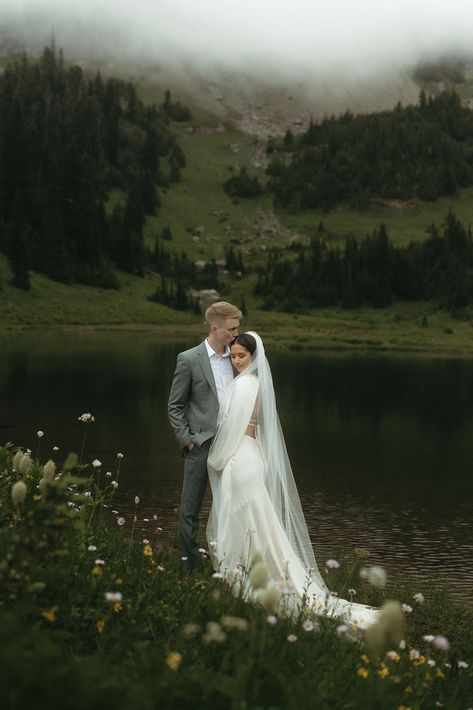 Hannah and Marcus decided to elope in the stunning mountains of Mount Rainier. Their intimate adventure elopement was sweet, surrounded by close family and friends. I feel fortunate to capture these romantic moments. If you need a wedding photographer for your destination elopement, reach out through my website today! Mountain Wedding Bride And Groom, Elopement Wedding Mountain, Bride And Groom Mountain Photos, Ireland Wedding Elopement, Dreamy Elopement Photos, Nature Elopement Photos, Bridal Photos Mountains, Elopement Aesthetic Mountains, My Rainier Elopement