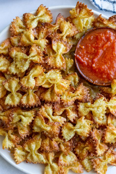 These easy air fryer pasta chips have been popular on tiktok and are so easy to make! Such a fun and delicious recipe! Air Fryer Pasta Chips, Air Fryer Pasta, Pasta Chips, Healthy Air Fryer, Air Fryer Oven Recipes, Air Fry Recipes, Easy Air Fryer, Air Fryer Dinner Recipes, Air Fryer Recipes Easy