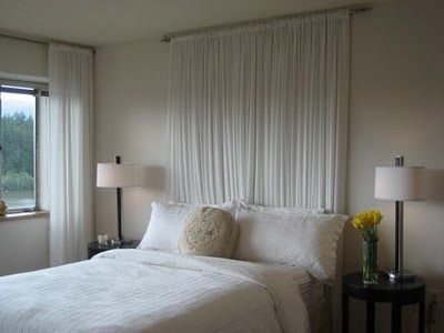 Sheer Curtains as headboard - this looks like our guest bed - have carolina blue sheers - would that work, or is it the monochromatic that makes it fit? Bedroom Ideas No Headboard, White Headboard Bedroom, Cheap Diy Headboard, Curtains Behind Bed, Diy Headboard Ideas, Headboard Alternative, Faux Headboard, Simple Headboard, Headboard Curtains