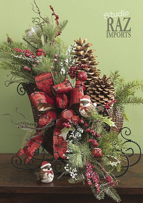 Sleigh arrangement. Christmas centerpiece and decorating ideas. Sleigh Floral Arrangements, Small Sleigh Decorating Ideas Christmas, Wicker Sleigh Christmas Decor, Christmas Sleigh Decorations, Christmas Centers, Centerpiece Christmas, Raz Imports, Christmas Flower Arrangements, Holiday Arrangement