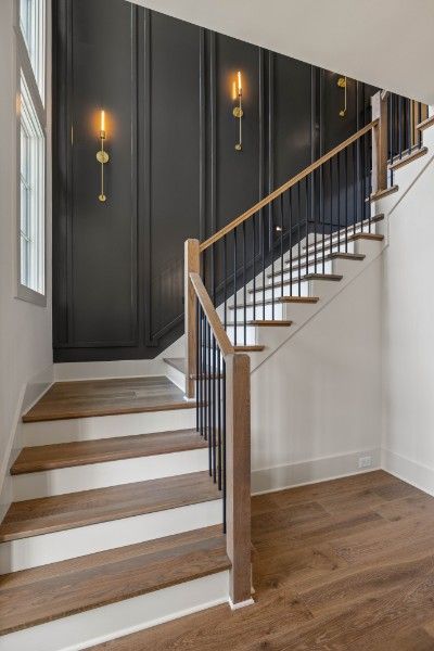 Listings Search Moody Staircase Wall, Wall Feature Staircase, Small Foyer Ideas Entryway With Stairs, Crawlspace Door Ideas Interior, Different Stairs Design, Staircase Walls Makeover, Stairwell Design Ideas, Funky Staircase Ideas, Wood Wall Stairs