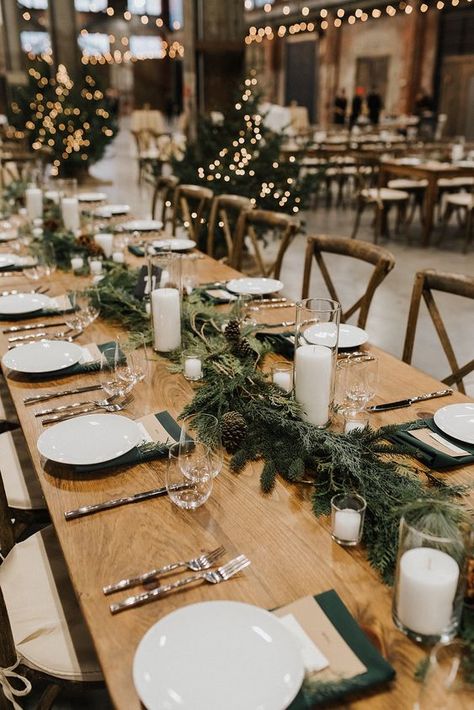 an evergreen and pinecone table garland with pillar candles is a lovely rustic decoration for a fall or winter wedding Greenery Wedding Centerpieces, Winter Wedding Table, Winter Wedding Centerpieces, Winter Wedding Venues, Rustic Winter Wedding, Tafel Decor, Winter Wedding Colors, Winter Wedding Decorations, Winter Wedding Flowers