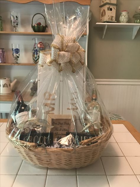 Wine wedding gift basket! Newly Wed Gift Basket, Wine Basket Gift Ideas Wedding, Wedding Gifts For Bride And Groom Basket, Engagement Gift Basket Ideas, Gift Basket For Bride, Bride And Groom Wedding Night Gift Basket, Wine Glass Gift Basket, Wedding Basket Gift Ideas, Wedding Gift Basket Ideas