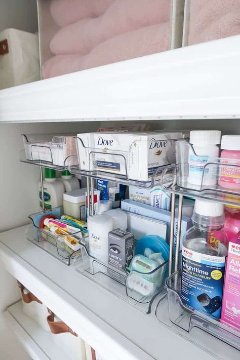 Maximize your linen closet storage space, how to use the top shelf, neutral organizers, and 13 ideas for organizing the linen closet. Linen Cleaning Closet Organization, Organizing Ideas For Bathroom Closet, Linen Closet In Bedroom, Linen Closet Medicine Organization, Bathroom Linen Closet Organization Master Bath, Deep Linen Closet Ideas, Open Hallway Linen Closet Ideas, Bathroom Organization Toothbrush, Linen Closet Design Layout